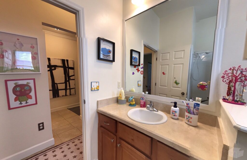 Primary bathroom with a walk-in shower and jacuzzi tub.