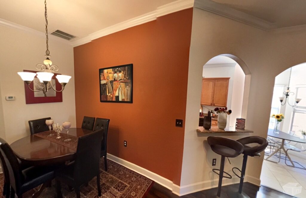 Open dining area connecting to the kitchen and living spaces.