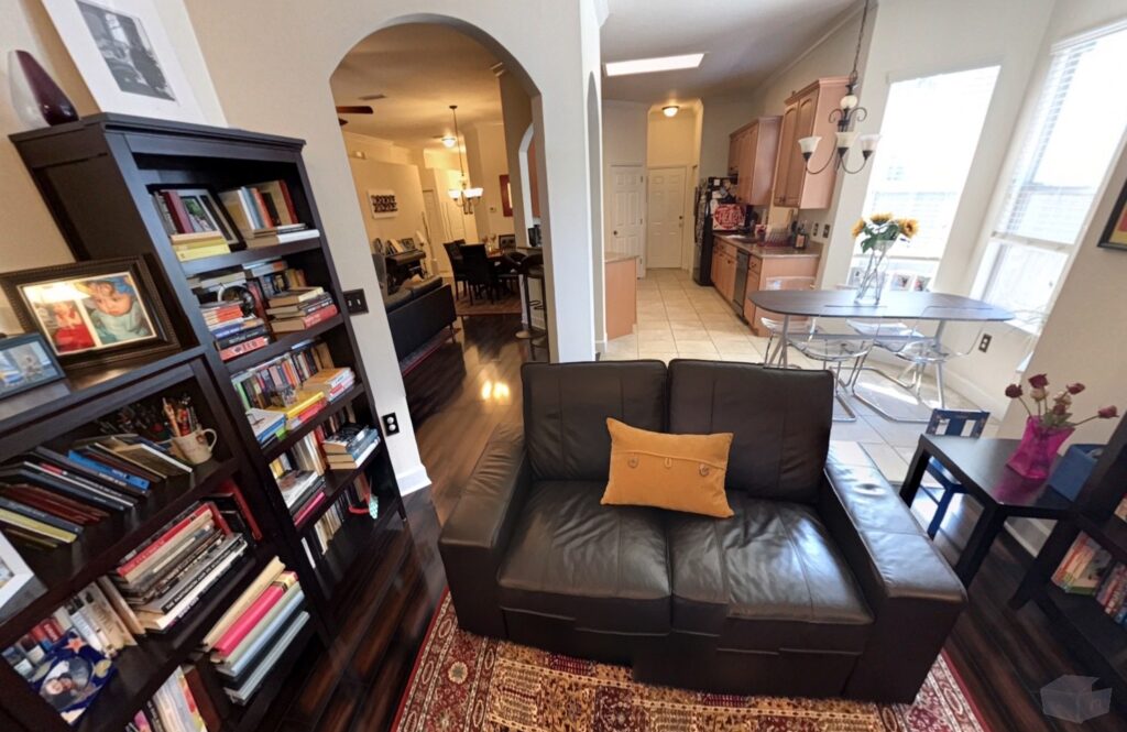 Living room with a gas-powered fireplace and built-in shelving.